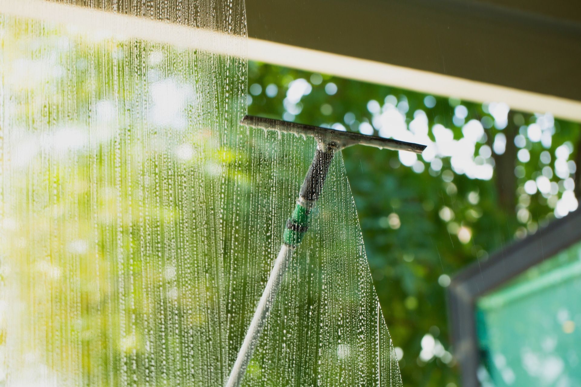 squeegee cleaning window