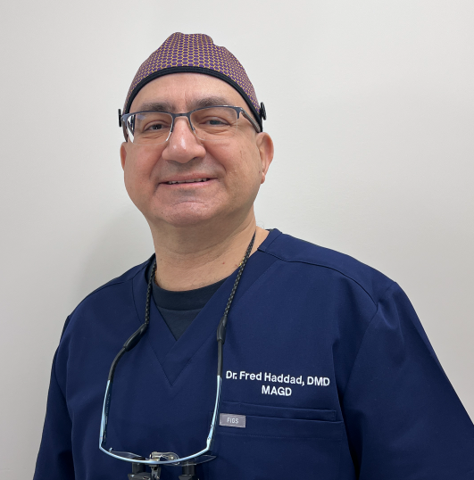 A man wearing glasses and a hat is a dentist