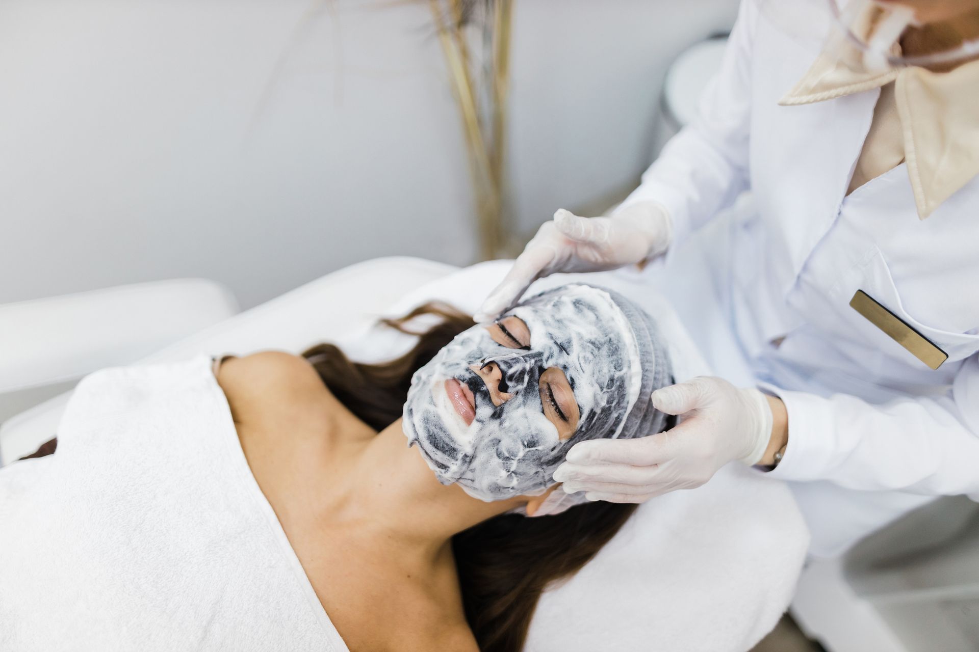A woman is getting an anti-aging cream. A woman is getting an anti-aging cream.
