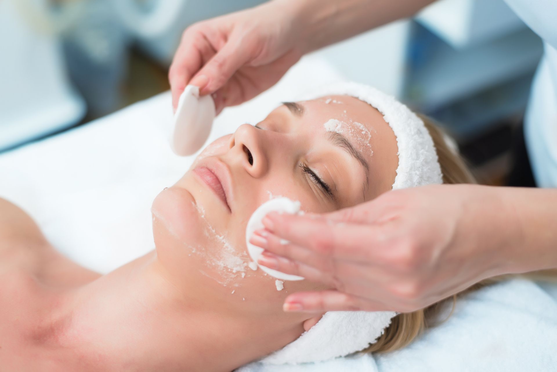 A woman is getting a facial treatment at a spa. A woman is getting a facial treatment at a spa.