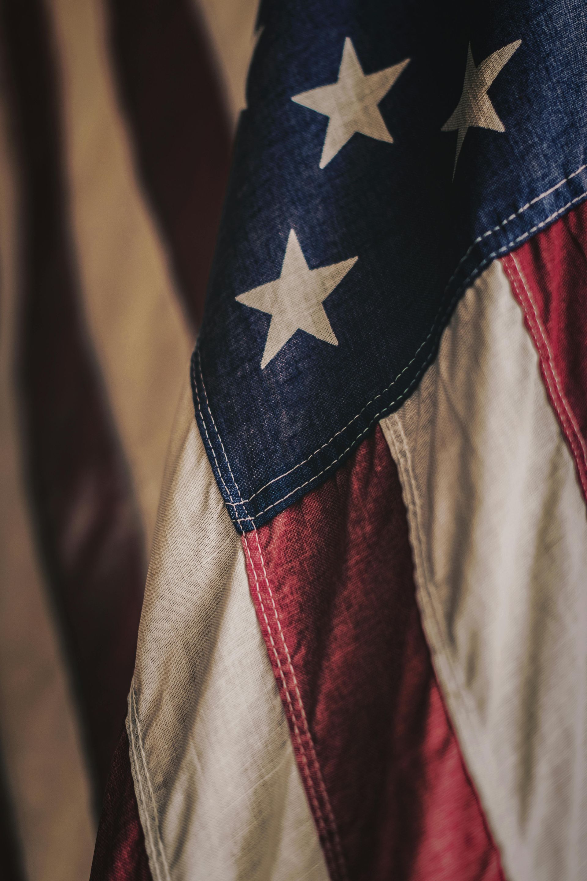 Close-up of a folded American flag with stars and red-and-white stripes