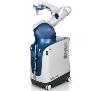 Robot for medical procedures, blue and white, labeled 