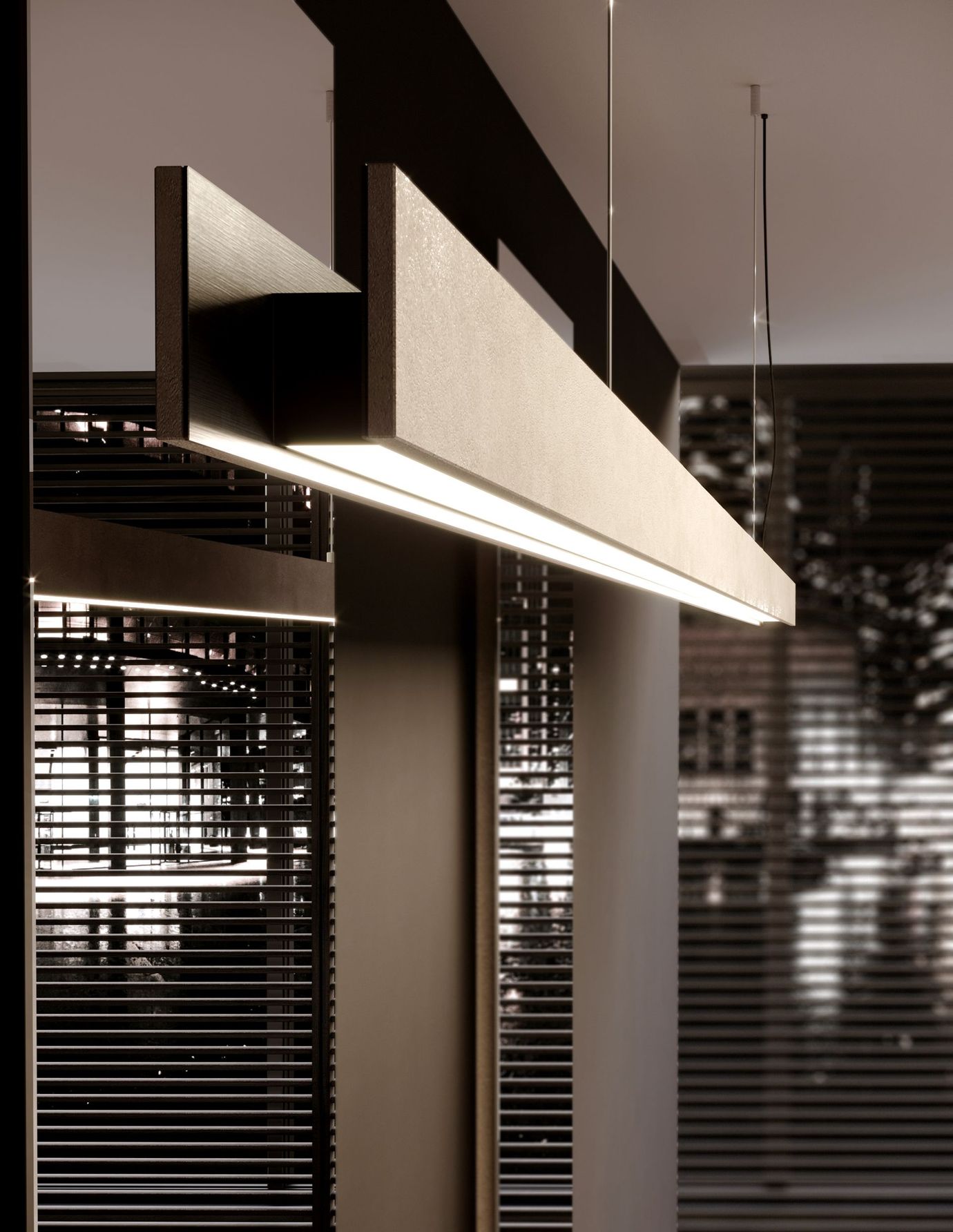 Lampadario moderno rettangolare con barra orizzontale, che emette luce, sospeso in una stanza.