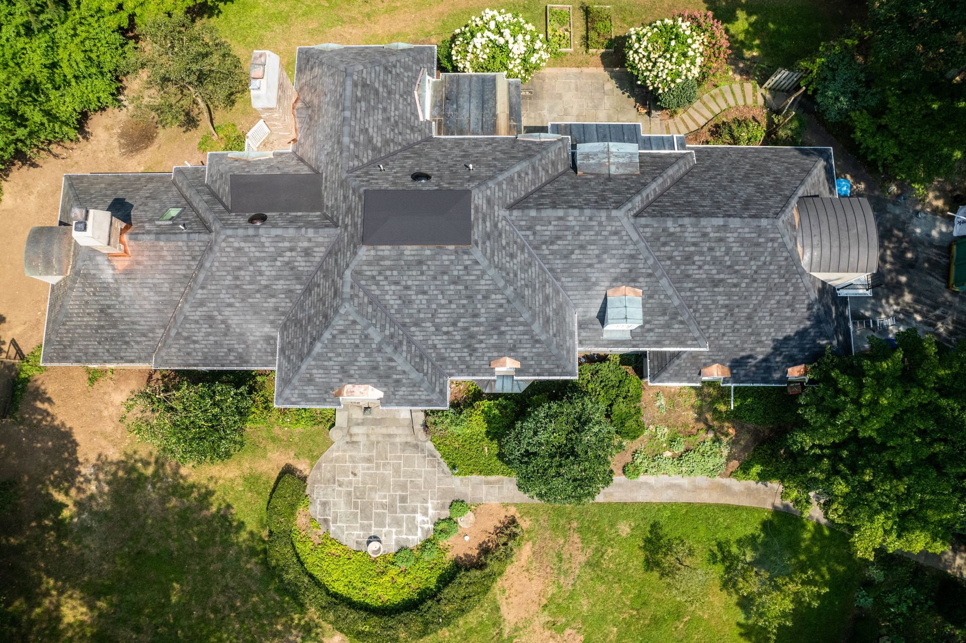 Expert Roof Installation Professional roof installation with dark metal roofing