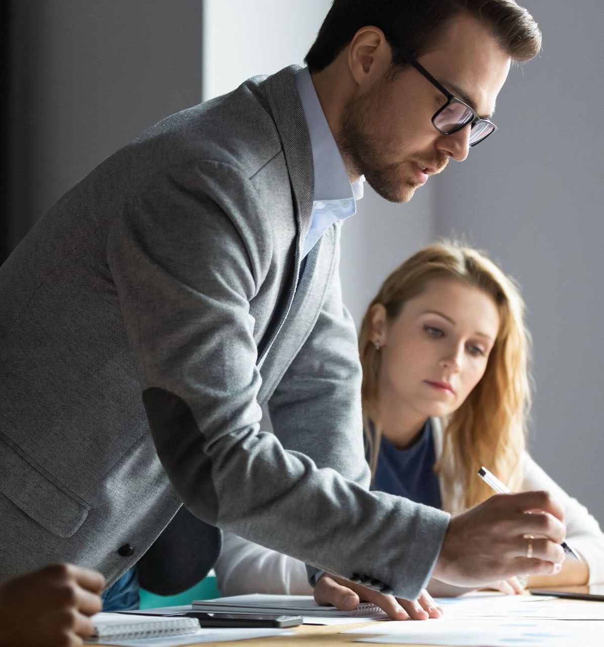 A man and a woman are looking at a piece of paper