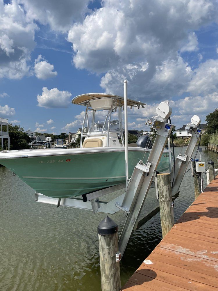 A boat is docked at a dock on a sunny day.