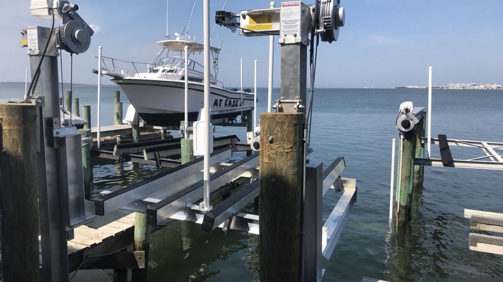 A boat is docked at a dock in the water.