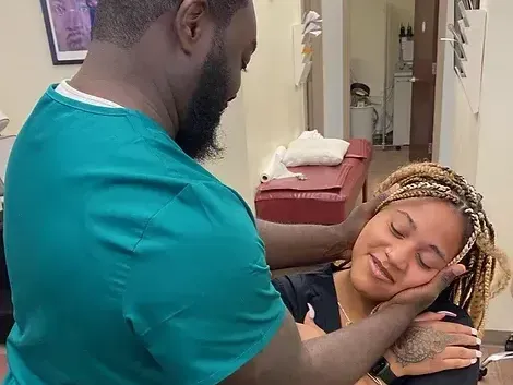 Dr. Sackey with a new patient