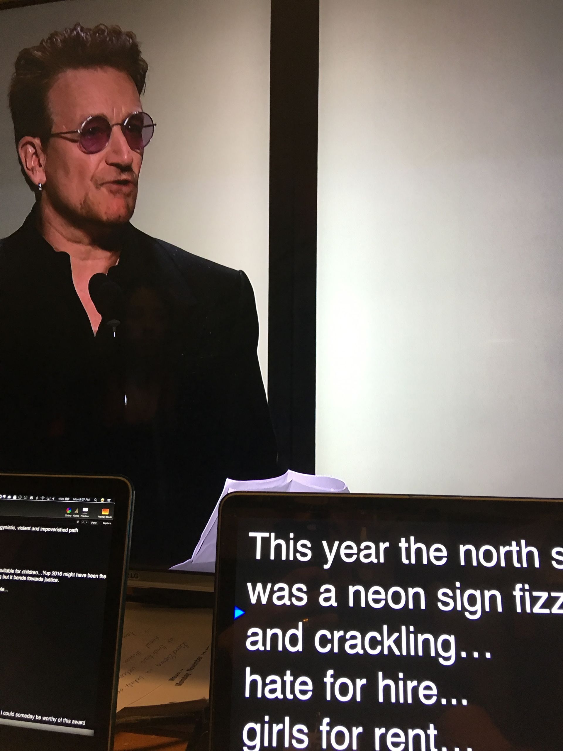 Bono speaking, with teleprompter 