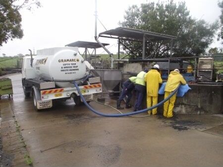Workers Servicing Grease Trap — Septic Tank Cleaning in Armidale, NSW