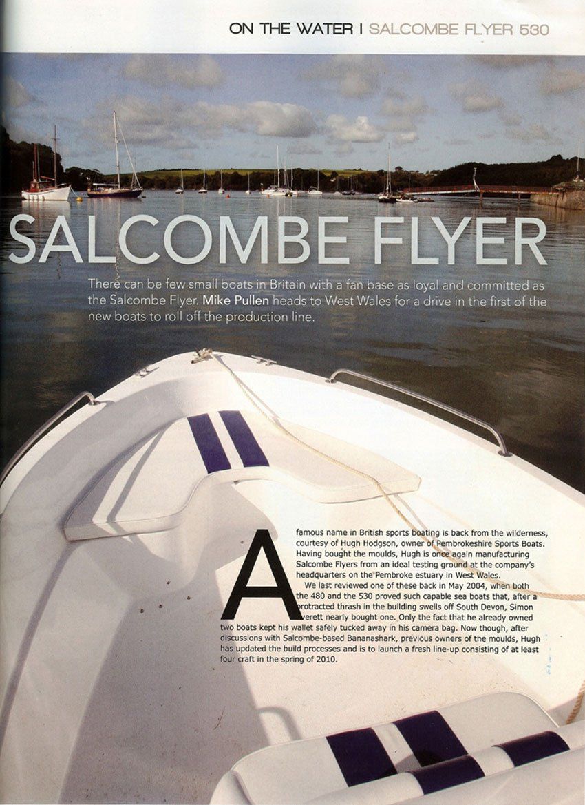 Boat's bow with blue stripes, on water, Salcombe Flyer title. Background shows shoreline and boats in a bay.