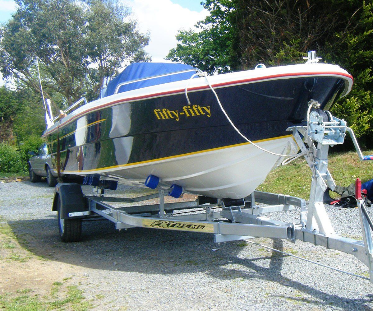 A dark blue motorboat named 