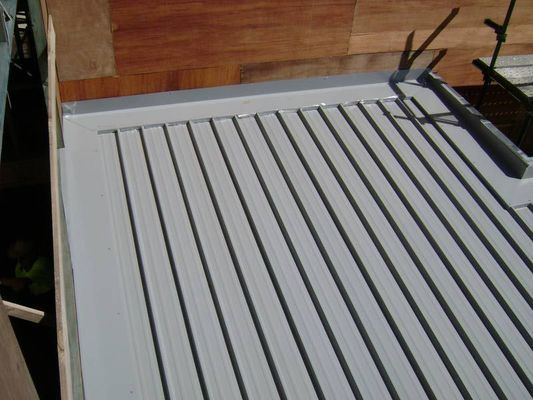 Grey Corrugated Metal Roof With Wooden Backing — R&M Sheetmetal Nowra Metal Roofing in South Nowra, NSW