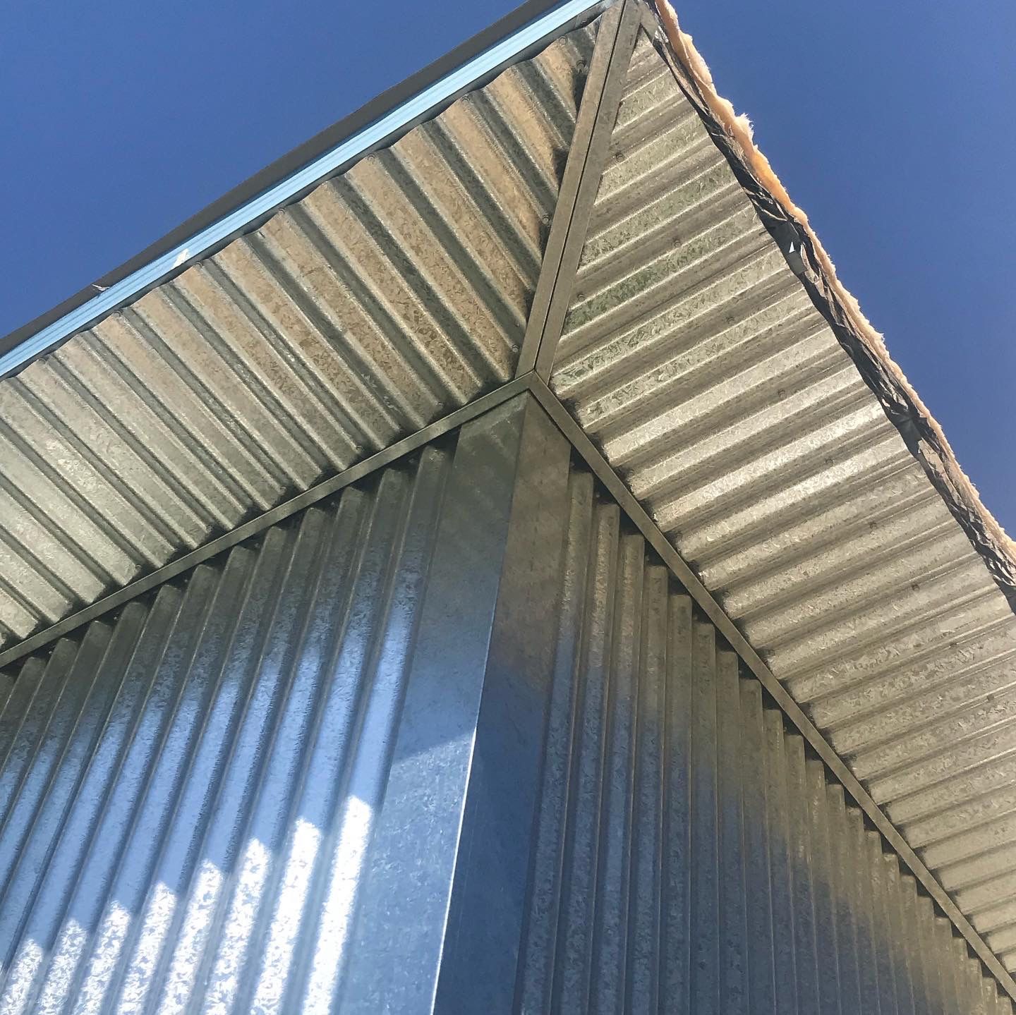 A metal building with a pointed edge — R&M Sheetmetal Nowra Metal Roofing in South Nowra, NSW