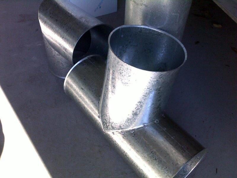 A Bunch of Metal Pipes Are Stacked on Top of Each Other — R&M Sheetmetal Nowra Metal Roofing in South Nowra, NSW