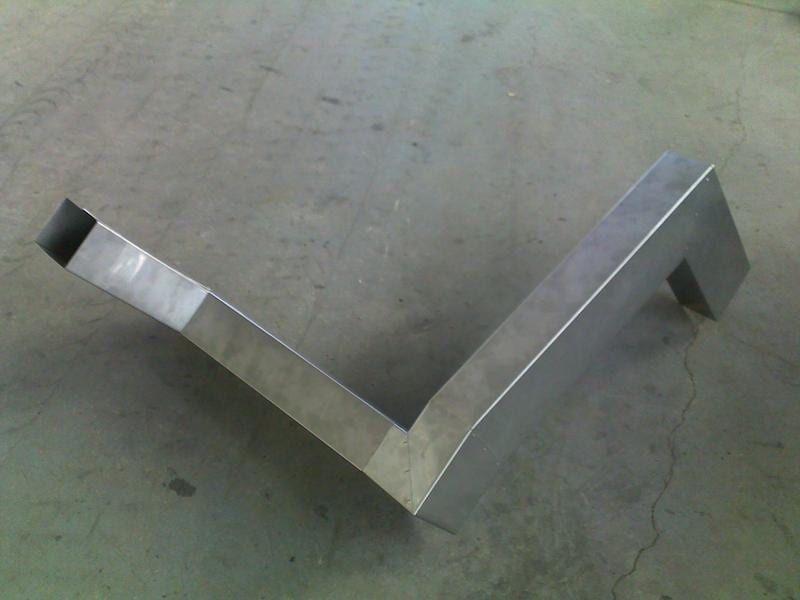 A Piece of Metal Is Sitting on A Concrete Surface — R&M Sheetmetal Nowra Metal Roofing in South Nowra, NSW