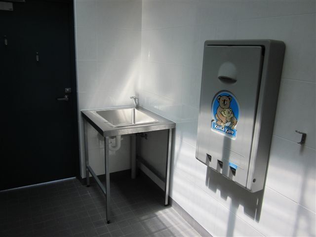 A Bathroom with A Sink and A Diaper Changing Station — R&M Sheetmetal Nowra Metal Roofing in South Nowra, NSW