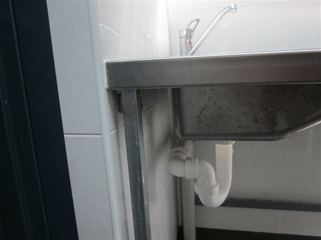 A Stainless Steel Sink with A White Pipe Underneath It — R&M Sheetmetal Nowra Metal Roofing in South Nowra, NSW