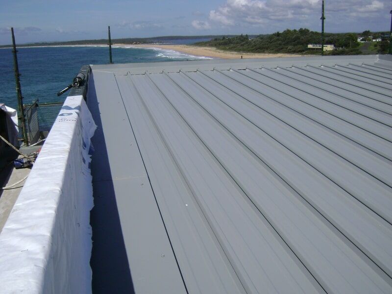 The Roof of A Building with A View of The Ocean — R&M Sheetmetal Nowra Metal Roofing in South Nowra, NSW