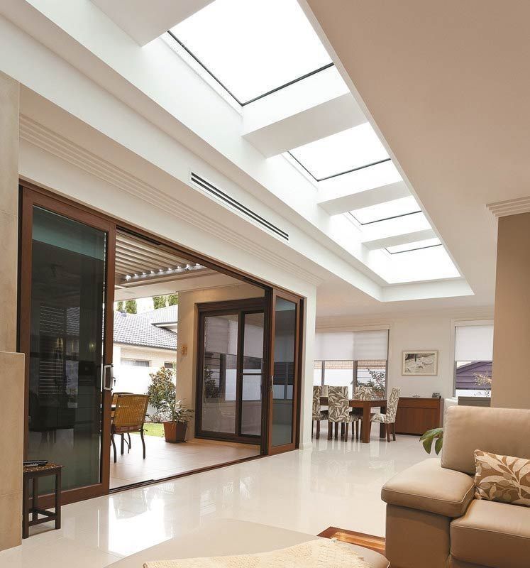 A Living Room with A Couch and A Skylight — R&M Sheetmetal Nowra Metal Roofing in South Nowra, NSW