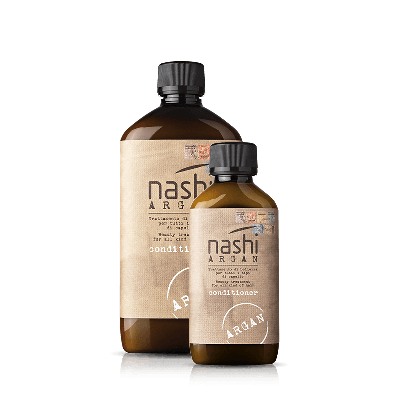 Due flaconi marroni di balsamo Nashi Argan con tappi neri, su sfondo bianco.