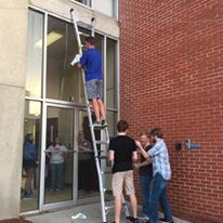 Volunteers Fixing Door Entrance