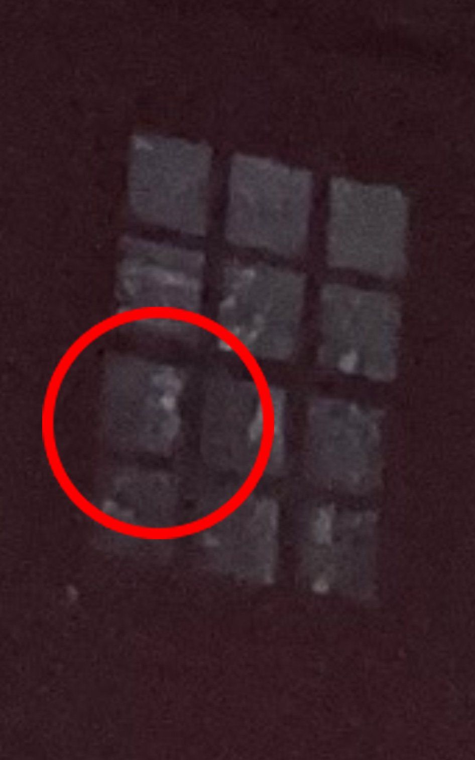 A cube puzzle with a red circle highlighting a section.
