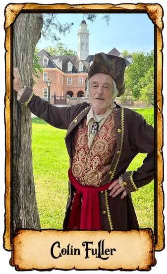 Portrait of Colin Fuller in a historical costume, leaning against a tree in a grassy estate with a manor in the background
