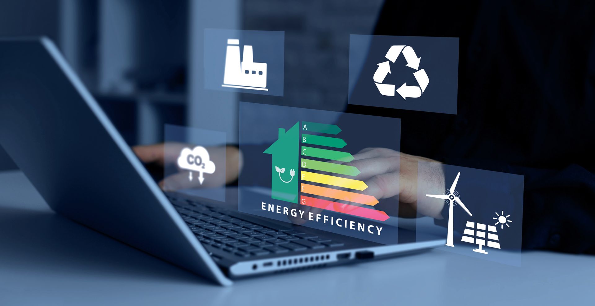 Laptop with floating sustainability icons, charts, and wind turbines highlighting green energy efficiency