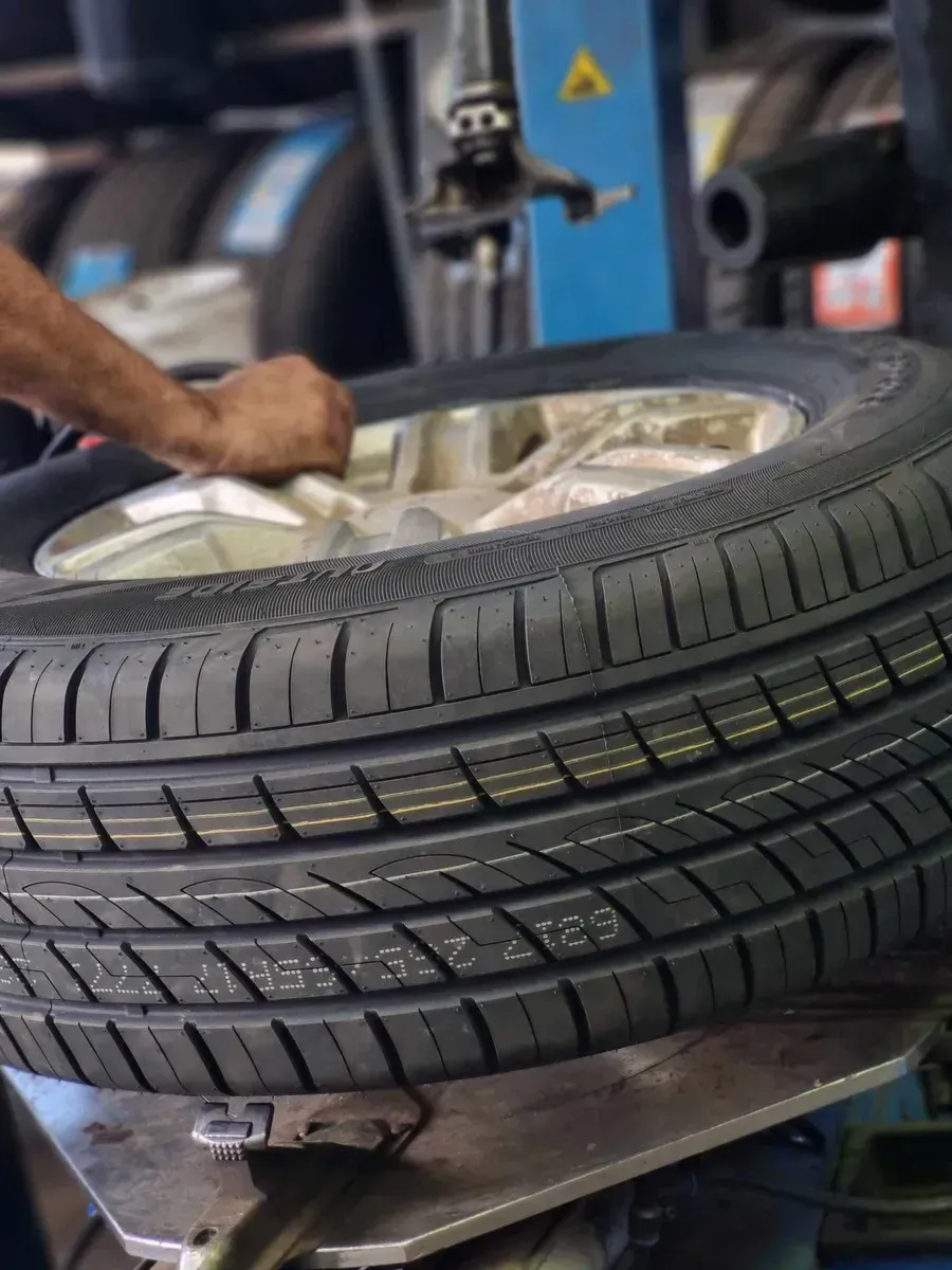 Tire Being Mounted on a Rim — BJM Mechanical Mufflers & Tyres in Oxenford, QLD