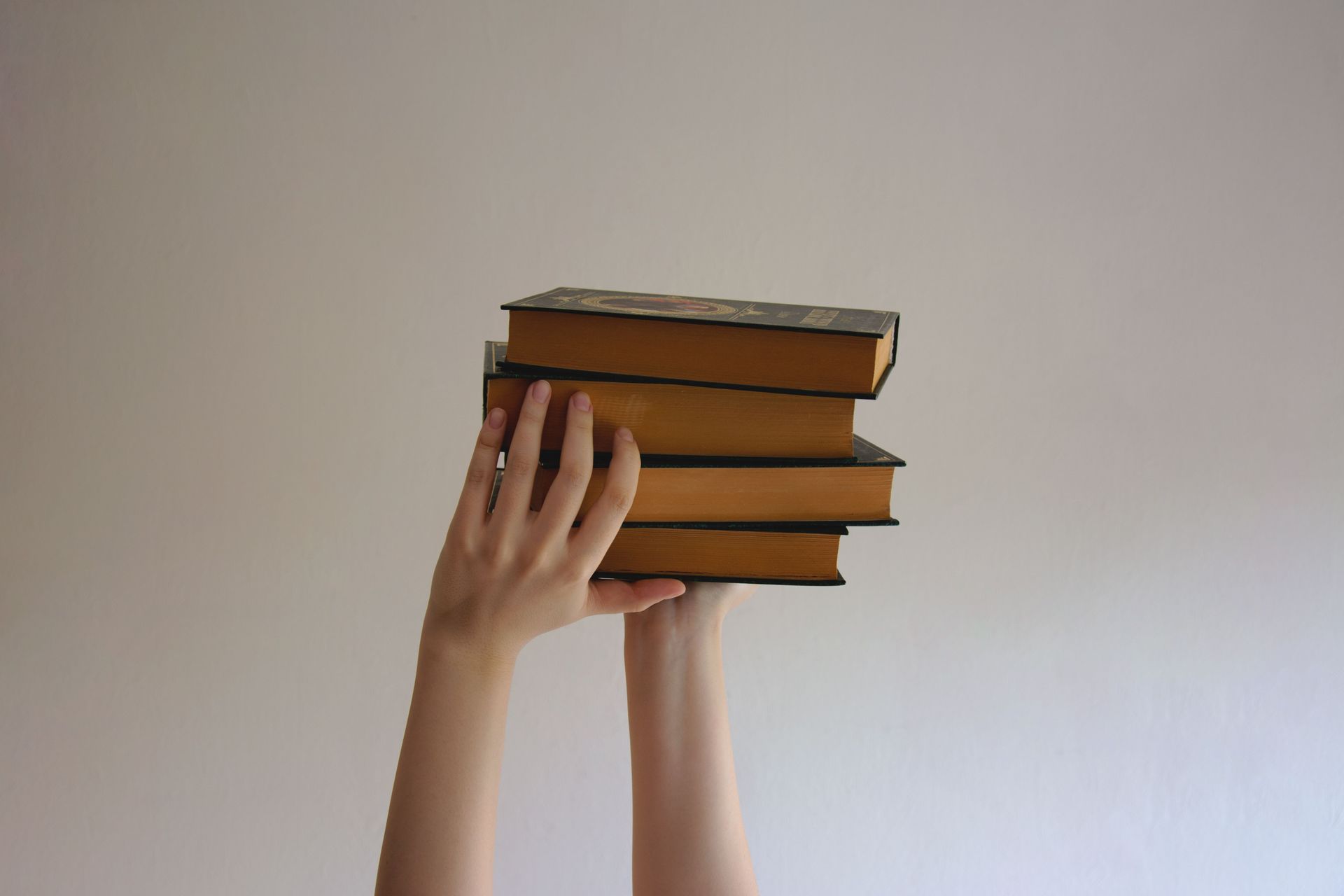 Hands holding books