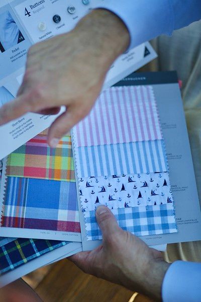 A person is holding a swatch of fabric with the number 4 on it