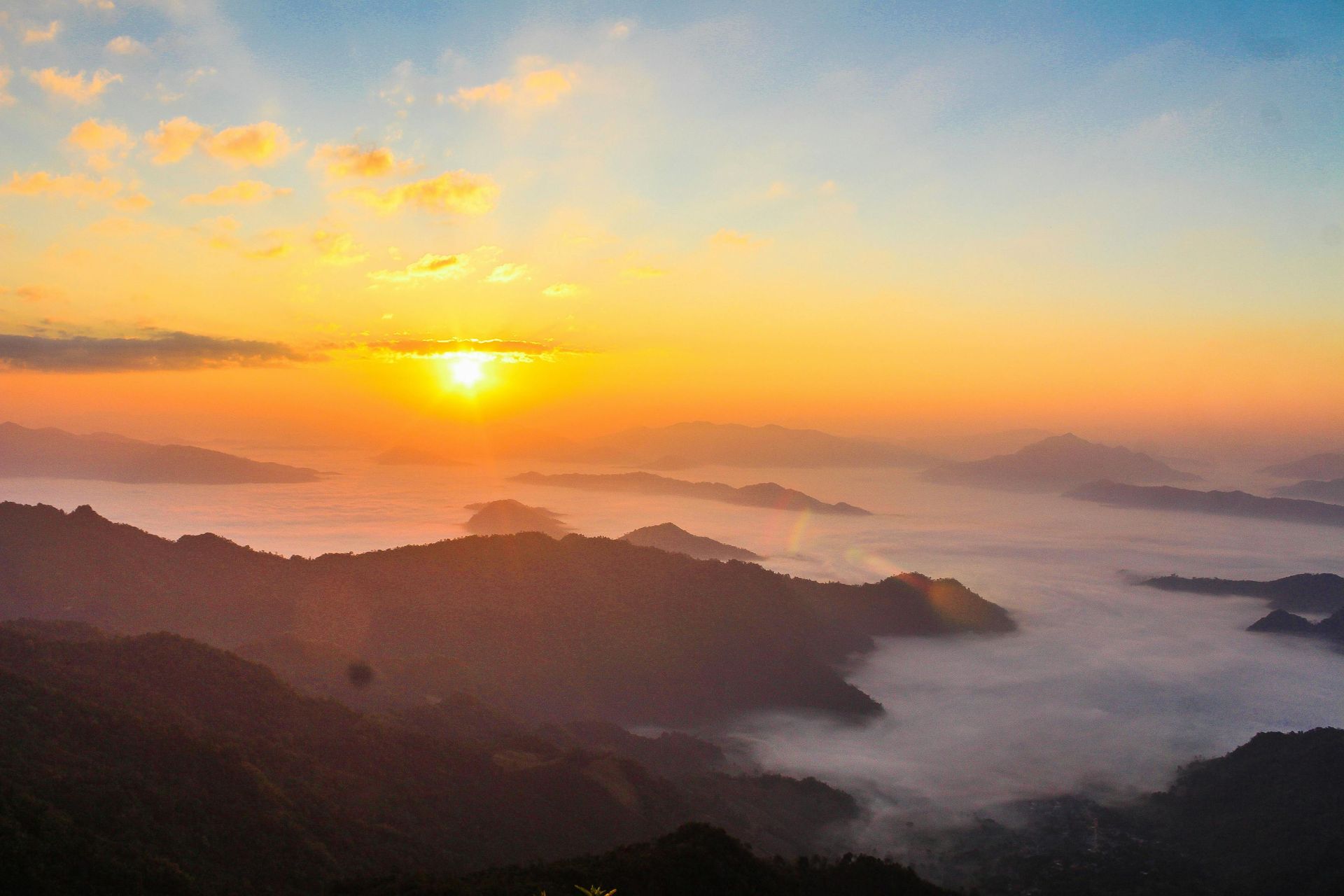 sunrise and golden hour over mist covered lanscape