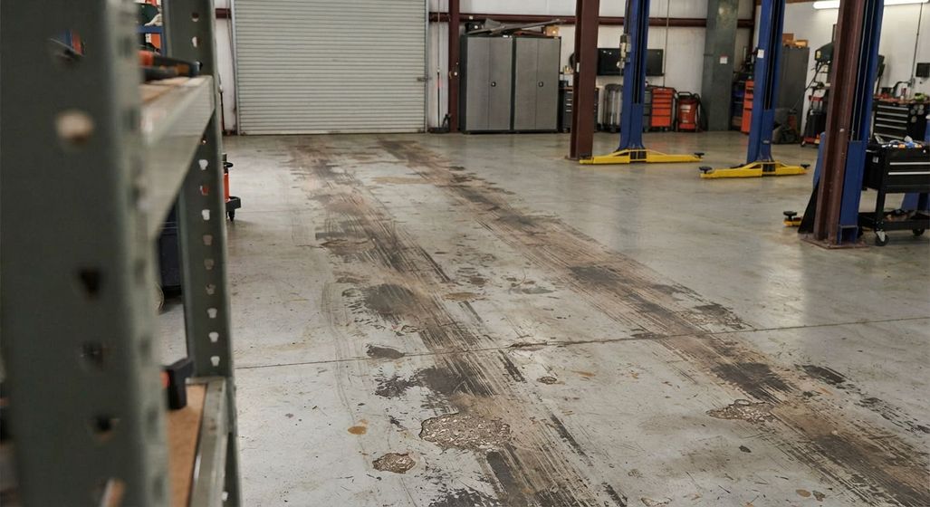Worn high-traffic commercial flooring with surface damage in Rancho Cordova