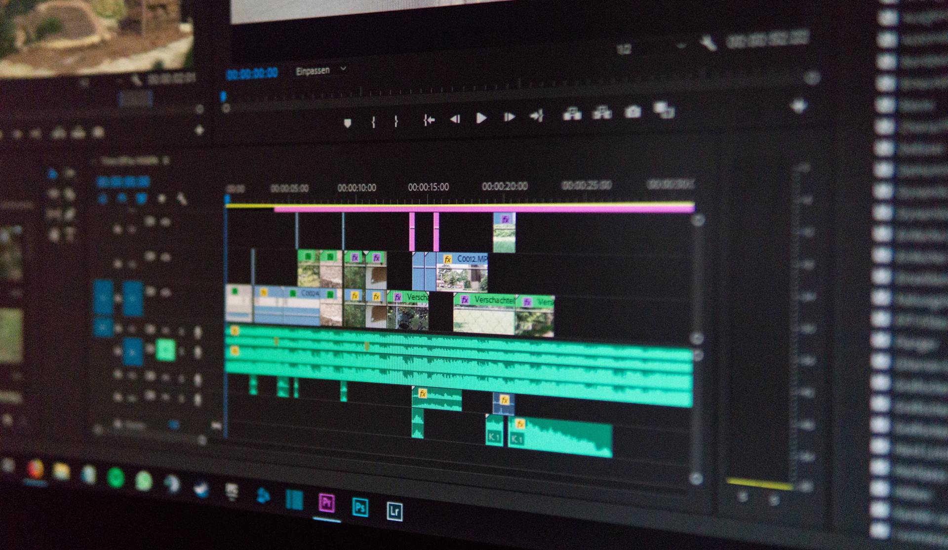 Video editing software interface on a computer screen, with video and audio tracks, timelines, and editing tools.