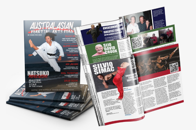MA BUSINESS MAGAZINE Pile of Australasian martial arts magazines, open to display articles and photos.