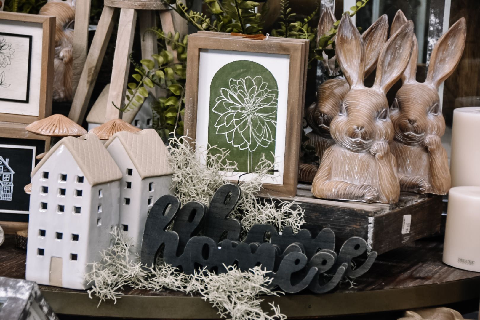 Easter home decor: bunny statues, houses, framed art, and 