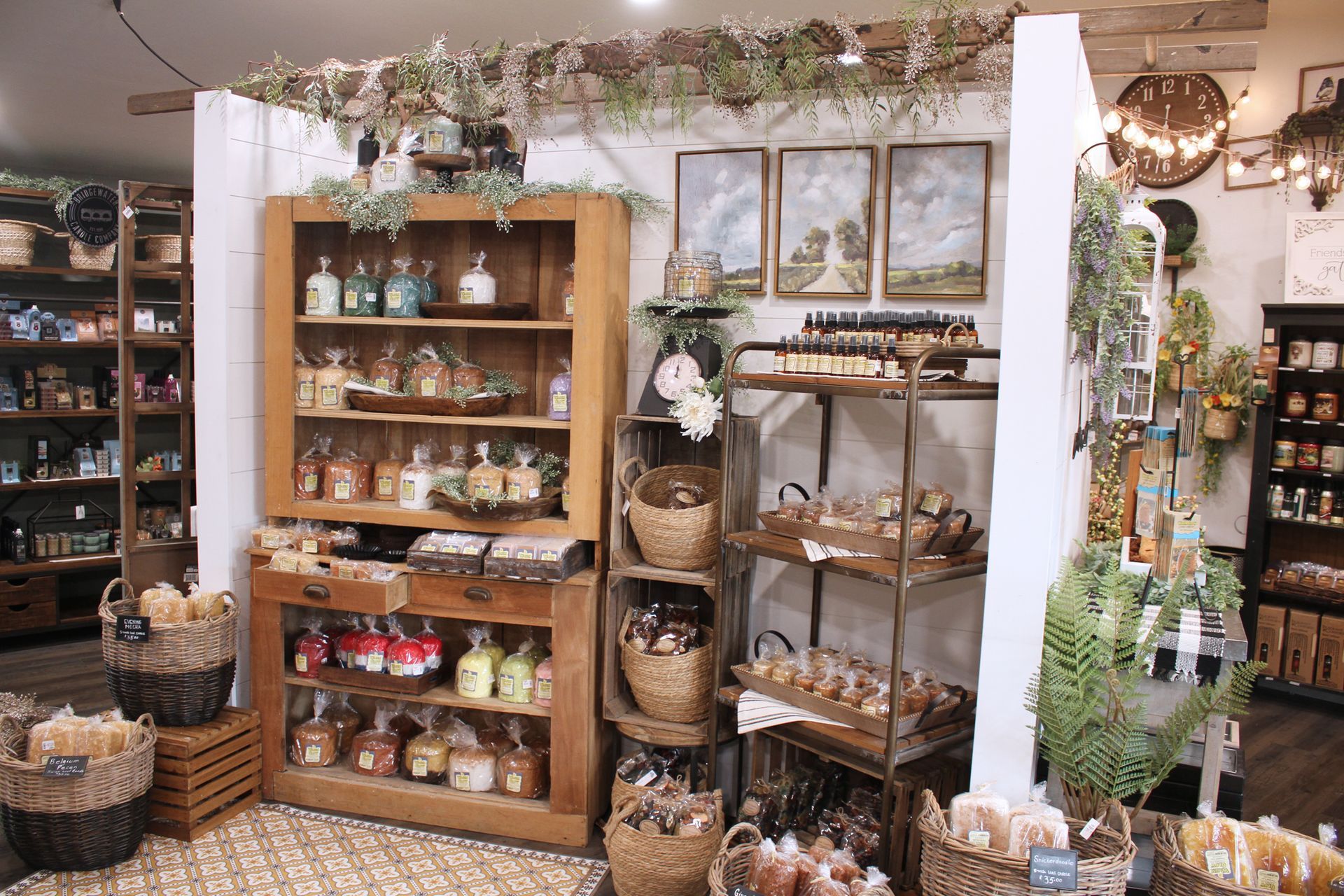 Shop display with shelves of bath products and decorative items. Rustic decor and baskets.