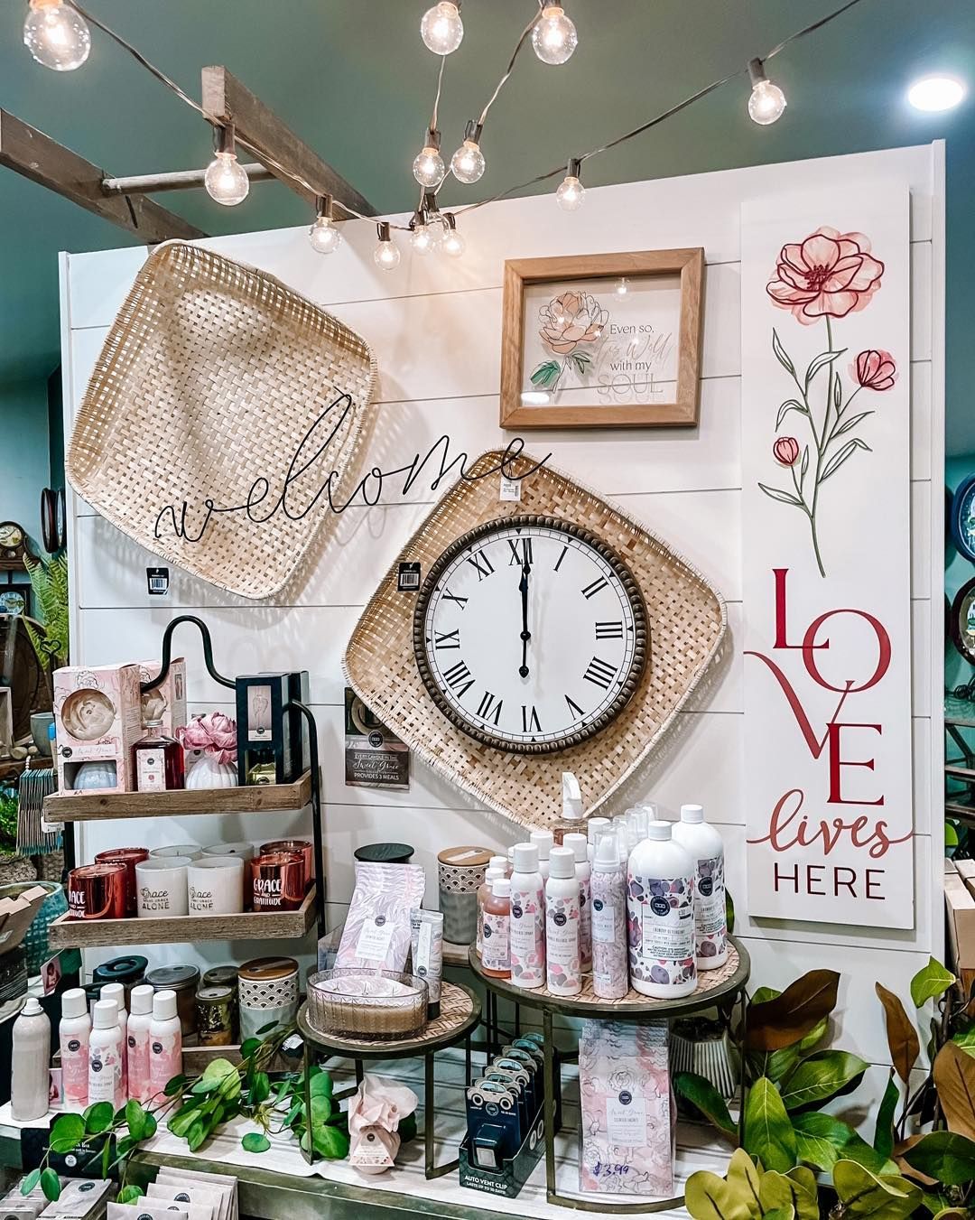 Retail display with decorative items, clock, and 