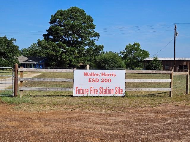 A picture of a sign that says future fire station site for Waller-Harris ESD 200.
