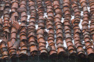 A close up of a roof with a lot of tiles on it