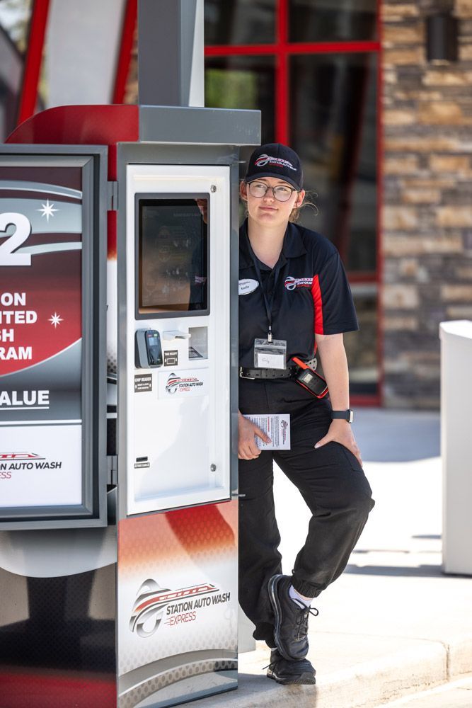 A man is leaning against a vending machine in front of a restaurant.