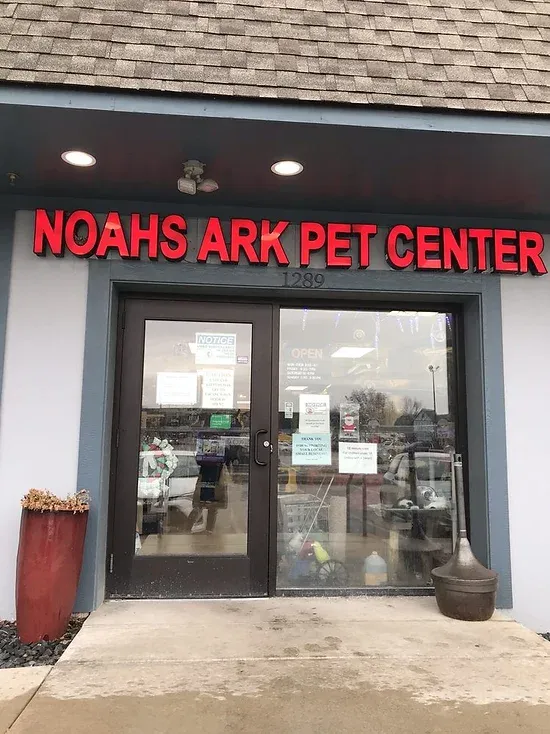 Noah's Ark Pet Center storefront with red lettering and double doors.
