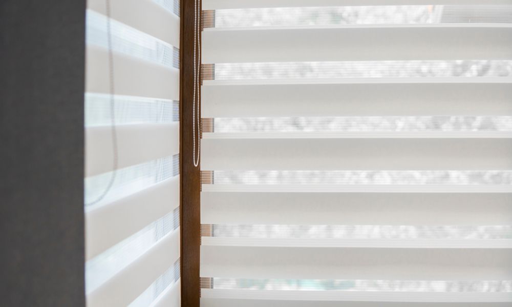 White Zebra Blinds Filtering Daylight Beside a Grey Wall — Another Blind Man in Sunshine Coast Hinterland, QLD