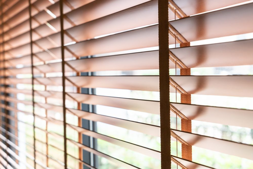 Sunlit Window Blinds With Warm Light Streaming Through Slats — Another Blind Man in Kawana Waters, QLD