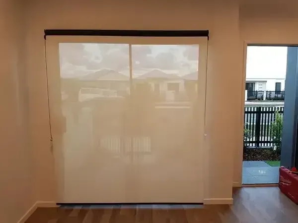 Closed White Roller Blind Covering a Large Window in a Room — Another Blind Man in Tewantin, QLD