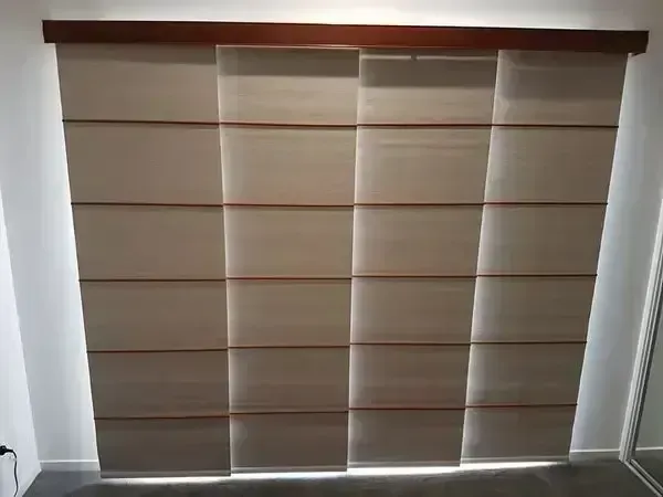 Beige and Brown Window Shades Covering a Wide Window With Light Seeping Through — Another Blind Man in Tewantin, QLD