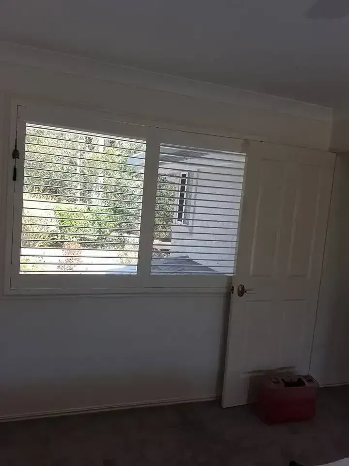 Empty Room With White Walls, Window, Closed Door, and a Red Box on the Floor — Another Blind Man in Tewantin, QLD