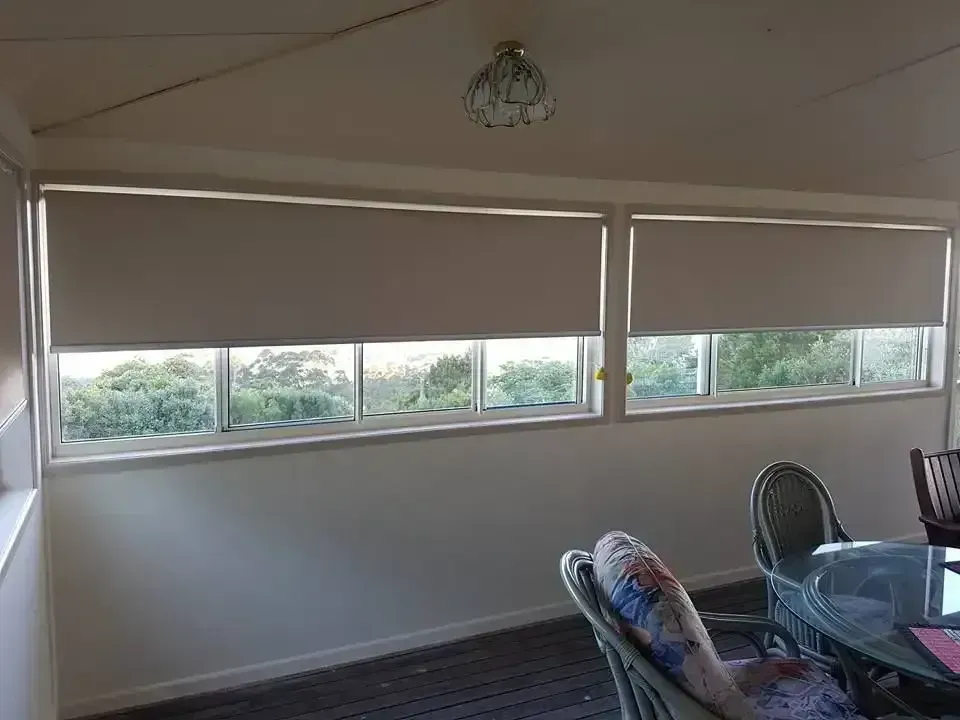 Sunlit Enclosed Porch With Roller Blinds, Windows, and Glass Table With Chairs — Another Blind Man in Tewantin, QLD