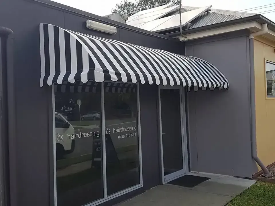 Storefront With Black-and-white Striped Awning Over Glass Doors and Windows — Another Blind Man in Tewantin, QLD
